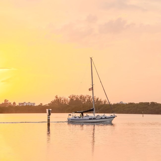 Sailboat at sunset - Michael Saunders & Company